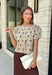 A classic print meets an effortlessly feminine silhouette in this charming knit cardigan! Featuring a soft tan knit with a playful brown polka dot print, this button-down cardigan is finished with sweet puff sleeves for an elevated touch. Whether worn buttoned as a top or layered over your favorite basics, this versatile piece is perfect for everything from office days to coffee dates and weekend outings.