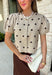 A classic print meets an effortlessly feminine silhouette in this charming knit cardigan! Featuring a soft tan knit with a playful brown polka dot print, this button-down cardigan is finished with sweet puff sleeves for an elevated touch. Whether worn buttoned as a top or layered over your favorite basics, this versatile piece is perfect for everything from office days to coffee dates and weekend outings.