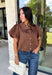 Elevate your everyday wardrobe with this effortlessly polished blouse from Entro. Designed in a rich chocolate brown hue, this timeless top features a classic button-front design with a collared neckline for a sophisticated look. Feminine puff sleeves and charming side tie details add a modern twist, creating a flattering silhouette that's easy to dress up or down. Crafted from breathable cotton, this versatile blouse is perfect for everything from office days to weekend brunches.