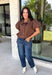 Elevate your everyday wardrobe with this effortlessly polished blouse from Entro. Designed in a rich chocolate brown hue, this timeless top features a classic button-front design with a collared neckline for a sophisticated look. Feminine puff sleeves and charming side tie details add a modern twist, creating a flattering silhouette that's easy to dress up or down. Crafted from breathable cotton, this versatile blouse is perfect for everything from office days to weekend brunches.