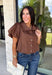 Elevate your everyday wardrobe with this effortlessly polished blouse from Entro. Designed in a rich chocolate brown hue, this timeless top features a classic button-front design with a collared neckline for a sophisticated look. Feminine puff sleeves and charming side tie details add a modern twist, creating a flattering silhouette that's easy to dress up or down. Crafted from breathable cotton, this versatile blouse is perfect for everything from office days to weekend brunches.