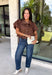 Elevate your everyday wardrobe with this effortlessly polished blouse from Entro. Designed in a rich chocolate brown hue, this timeless top features a classic button-front design with a collared neckline for a sophisticated look. Feminine puff sleeves and charming side tie details add a modern twist, creating a flattering silhouette that's easy to dress up or down. Crafted from breathable cotton, this versatile blouse is perfect for everything from office days to weekend brunches.
