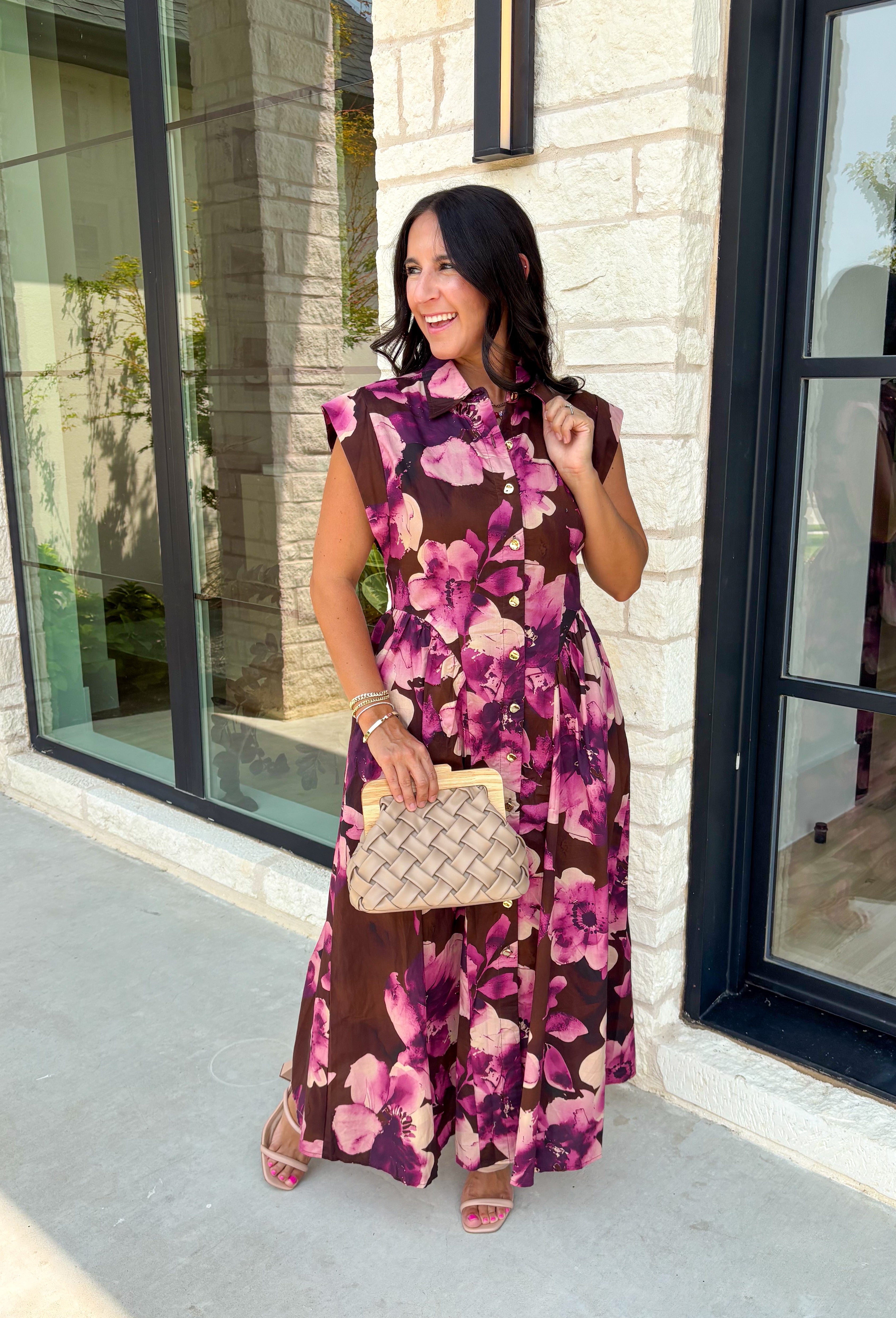Timeless florals meet effortless comfort in this beautiful midi dress that's ready for every occasion on your fall calendar! Designed in a rich brown hue with a stunning pink and purple floral print, this cotton dress is both feminine and easy to wear. The collared v-neckline and button-front closure create a polished look, while the flowy midi silhouette and cap sleeves keep it comfortable from morning to night. 