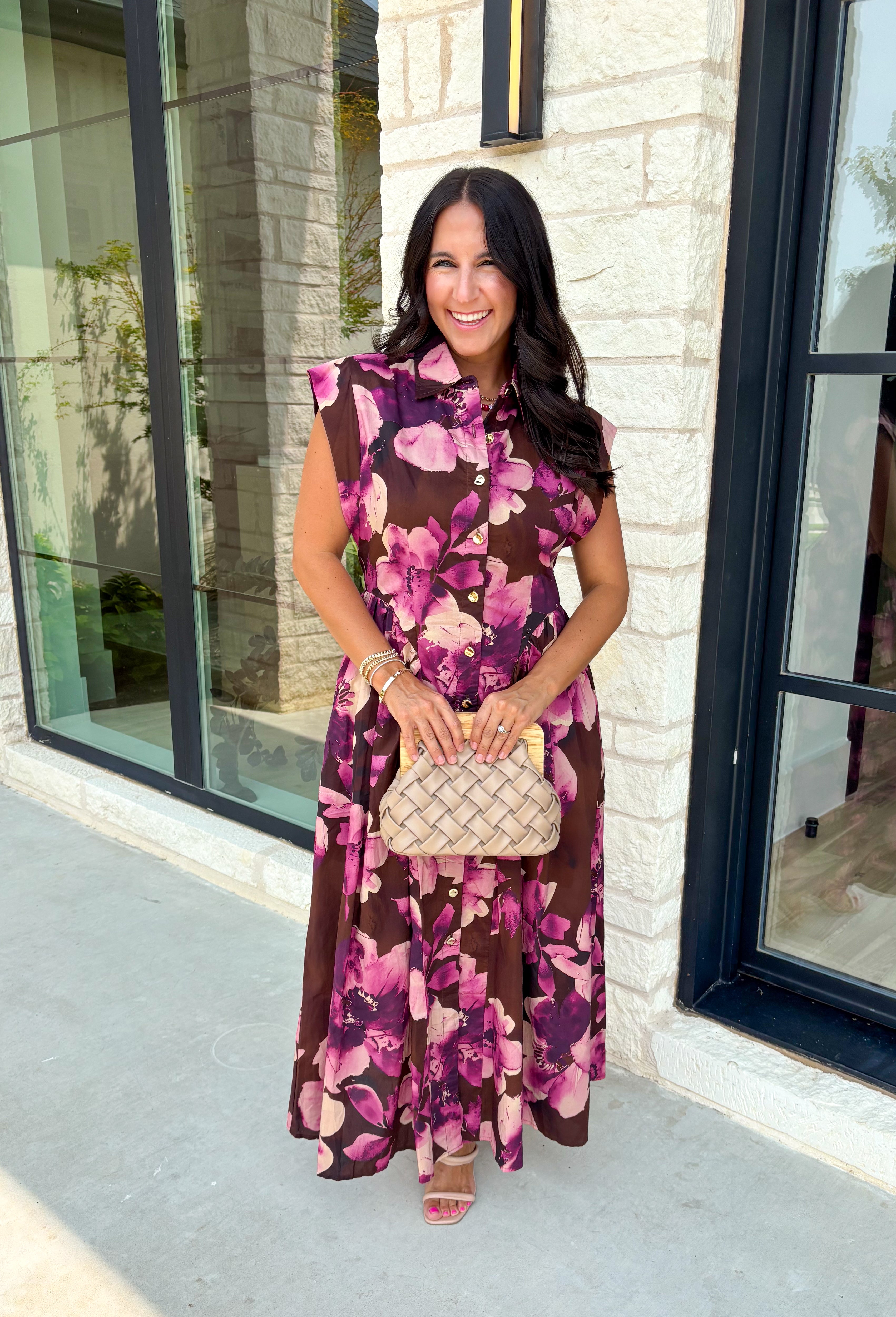 Timeless florals meet effortless comfort in this beautiful midi dress that's ready for every occasion on your fall calendar! Designed in a rich brown hue with a stunning pink and purple floral print, this cotton dress is both feminine and easy to wear. The collared v-neckline and button-front closure create a polished look, while the flowy midi silhouette and cap sleeves keep it comfortable from morning to night. 