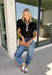 Elevate your everyday wardrobe with this effortlessly polished top from Entro. Designed in a classic black hue, this versatile blouse features beautiful tan and cream contrast binding along the flattering v-neckline for a sophisticated touch. The nonfunctional button detail at the front adds timeless charm, while the short puff sleeves with contrast cuffs create a feminine silhouette. Easy to dress up or down, this top is perfect for workdays, dinner dates, and everything in between.