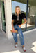 Elevate your everyday wardrobe with this effortlessly polished top from Entro. Designed in a classic black hue, this versatile blouse features beautiful tan and cream contrast binding along the flattering v-neckline for a sophisticated touch. The nonfunctional button detail at the front adds timeless charm, while the short puff sleeves with contrast cuffs create a feminine silhouette. Easy to dress up or down, this top is perfect for workdays, dinner dates, and everything in between.