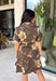 Celebrate the beauty of the season in this effortlessly timeless dress from Entro. Designed in a rich deep olive hue, this button-down dress features a beautiful mix of tan and black stripes paired with a fall-inspired floral print in shades of tan, olive, rust, and brown. The classic button-front silhouette creates an effortlessly polished look, while the fully lined design and convenient side pockets make it as practical as it is beautiful. 