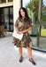 Celebrate the beauty of the season in this effortlessly timeless dress from Entro. Designed in a rich deep olive hue, this button-down dress features a beautiful mix of tan and black stripes paired with a fall-inspired floral print in shades of tan, olive, rust, and brown. The classic button-front silhouette creates an effortlessly polished look, while the fully lined design and convenient side pockets make it as practical as it is beautiful. 
