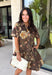 Celebrate the beauty of the season in this effortlessly timeless dress from Entro. Designed in a rich deep olive hue, this button-down dress features a beautiful mix of tan and black stripes paired with a fall-inspired floral print in shades of tan, olive, rust, and brown. The classic button-front silhouette creates an effortlessly polished look, while the fully lined design and convenient side pockets make it as practical as it is beautiful. 