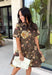Celebrate the beauty of the season in this effortlessly timeless dress from Entro. Designed in a rich deep olive hue, this button-down dress features a beautiful mix of tan and black stripes paired with a fall-inspired floral print in shades of tan, olive, rust, and brown. The classic button-front silhouette creates an effortlessly polished look, while the fully lined design and convenient side pockets make it as practical as it is beautiful. 