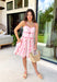 This light pink floral dress is the perfect mix of flirty and feminine for summer! The sweetheart neckline and delicate floral print create such a romantic feel, while the small front cutout adds just the right touch of playful detail. Adjustable straps and a smocked back give you that comfortable, flattering fit, and the pink trim throughout ties everything together beautifully. Fully lined and lightweight, it’s perfect for date nights, showers, or any special summer plans. 