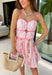 This light pink floral dress is the perfect mix of flirty and feminine for summer! The sweetheart neckline and delicate floral print create such a romantic feel, while the small front cutout adds just the right touch of playful detail. Adjustable straps and a smocked back give you that comfortable, flattering fit, and the pink trim throughout ties everything together beautifully. Fully lined and lightweight, it’s perfect for date nights, showers, or any special summer plans. 