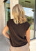 The perfect layering piece for fall has arrived! This chocolate brown sleeveless button-down cardigan is a timeless staple you'll reach for again and again. Crafted from a soft, lightweight knit, it's cozy without feeling bulky, making it perfect for layering over dresses, fitted tees, or long sleeve tops as the weather cools. Whether you wear it buttoned as a sweater vest or open for a relaxed layered look, this versatile knit is an effortless addition to your autumn wardrobe.