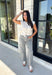 The perfect layering piece for fall has arrived! This oatmeal sleeveless button-down cardigan is a timeless staple you'll reach for again and again. Crafted from a soft, lightweight knit, it's cozy without feeling bulky, making it perfect for layering over dresses, fitted tees, or long sleeve tops as the weather cools. Whether you wear it buttoned as a sweater vest or open for a relaxed layered look, this versatile knit is an effortless addition to your autumn wardrobe.