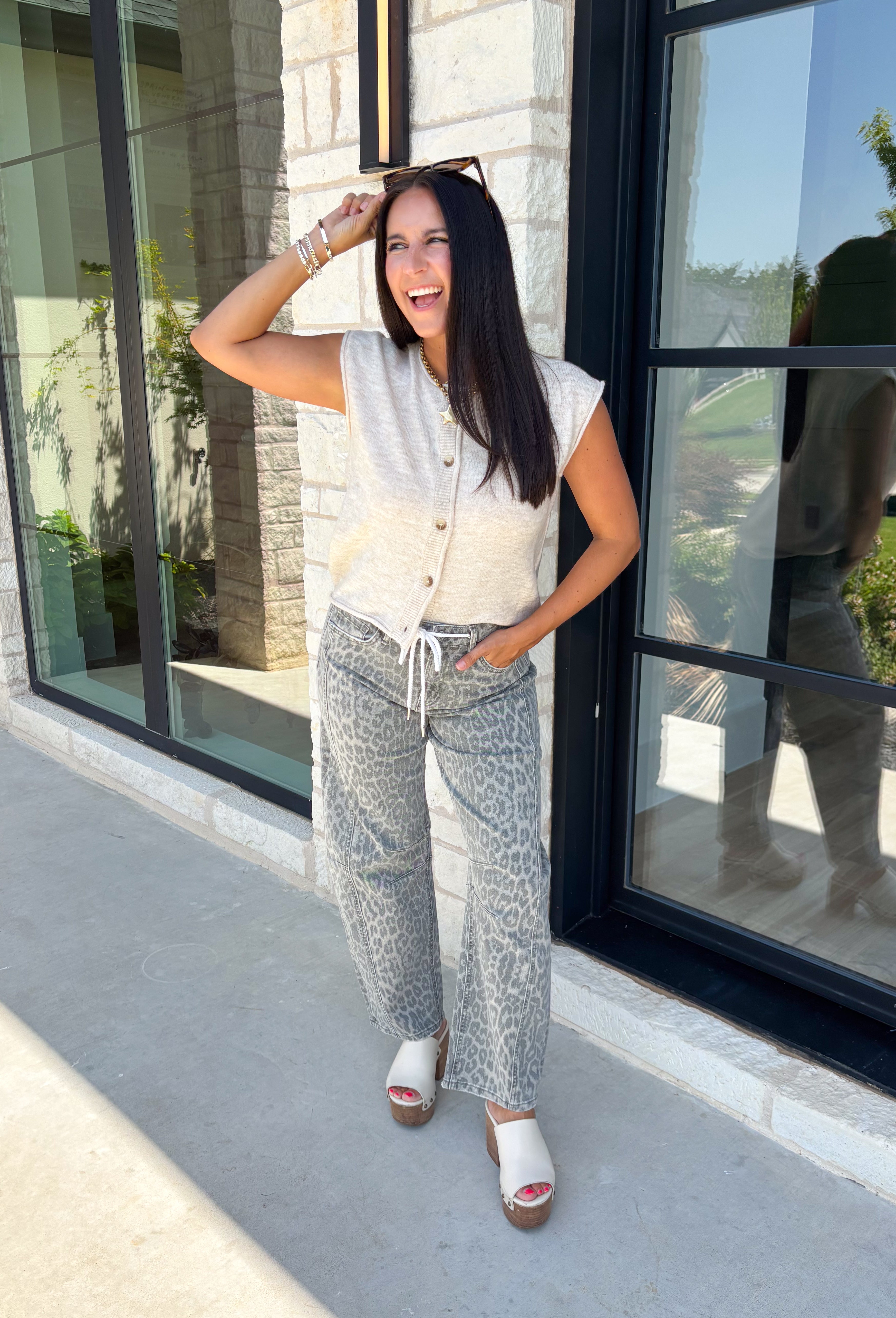 The perfect layering piece for fall has arrived! This oatmeal sleeveless button-down cardigan is a timeless staple you'll reach for again and again. Crafted from a soft, lightweight knit, it's cozy without feeling bulky, making it perfect for layering over dresses, fitted tees, or long sleeve tops as the weather cools. Whether you wear it buttoned as a sweater vest or open for a relaxed layered look, this versatile knit is an effortless addition to your autumn wardrobe.