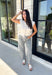 The perfect layering piece for fall has arrived! This oatmeal sleeveless button-down cardigan is a timeless staple you'll reach for again and again. Crafted from a soft, lightweight knit, it's cozy without feeling bulky, making it perfect for layering over dresses, fitted tees, or long sleeve tops as the weather cools. Whether you wear it buttoned as a sweater vest or open for a relaxed layered look, this versatile knit is an effortless addition to your autumn wardrobe.