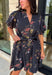 Embrace the beauty of the season in this effortlessly feminine floral dress that's made for all your favorite fall occasions. Designed with a classic black backdrop and adorned with a rich floral print in gorgeous autumn-inspired hues, this dress is the perfect combination of timeless elegance and everyday comfort. The ruffled v-neckline and puff sleeves add a romantic touch, while the self-tie waist creates a flattering silhouette you'll love. 