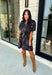 Embrace the beauty of the season in this effortlessly feminine floral dress that's made for all your favorite fall occasions. Designed with a classic black backdrop and adorned with a rich floral print in gorgeous autumn-inspired hues, this dress is the perfect combination of timeless elegance and everyday comfort. The ruffled v-neckline and puff sleeves add a romantic touch, while the self-tie waist creates a flattering silhouette you'll love. 