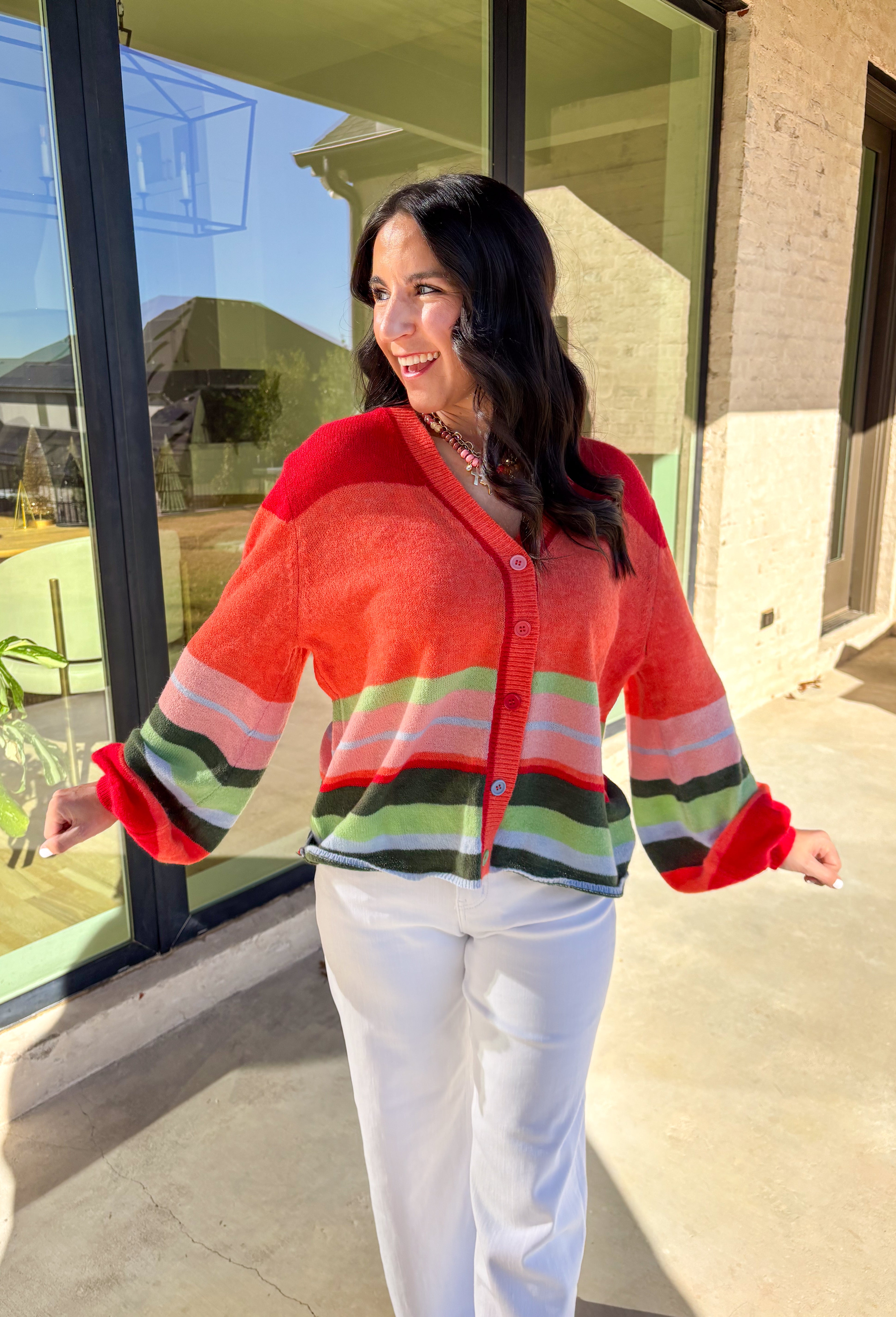 Bright, cozy, and perfect for spring layering, this coral button-down cardigan by Fate adds a happy pop of color to any outfit. Featuring a playful mix of red, pink, green, and blue stripes, this lightweight knit feels fun yet easy to wear. Soft and comfortable with just the right amount of warmth, it’s ideal for breezy mornings, cool evenings, or tossing on over your favorite spring basics.