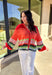 Bright, cozy, and perfect for spring layering, this coral button-down cardigan by Fate adds a happy pop of color to any outfit. Featuring a playful mix of red, pink, green, and blue stripes, this lightweight knit feels fun yet easy to wear. Soft and comfortable with just the right amount of warmth, it’s ideal for breezy mornings, cool evenings, or tossing on over your favorite spring basics.