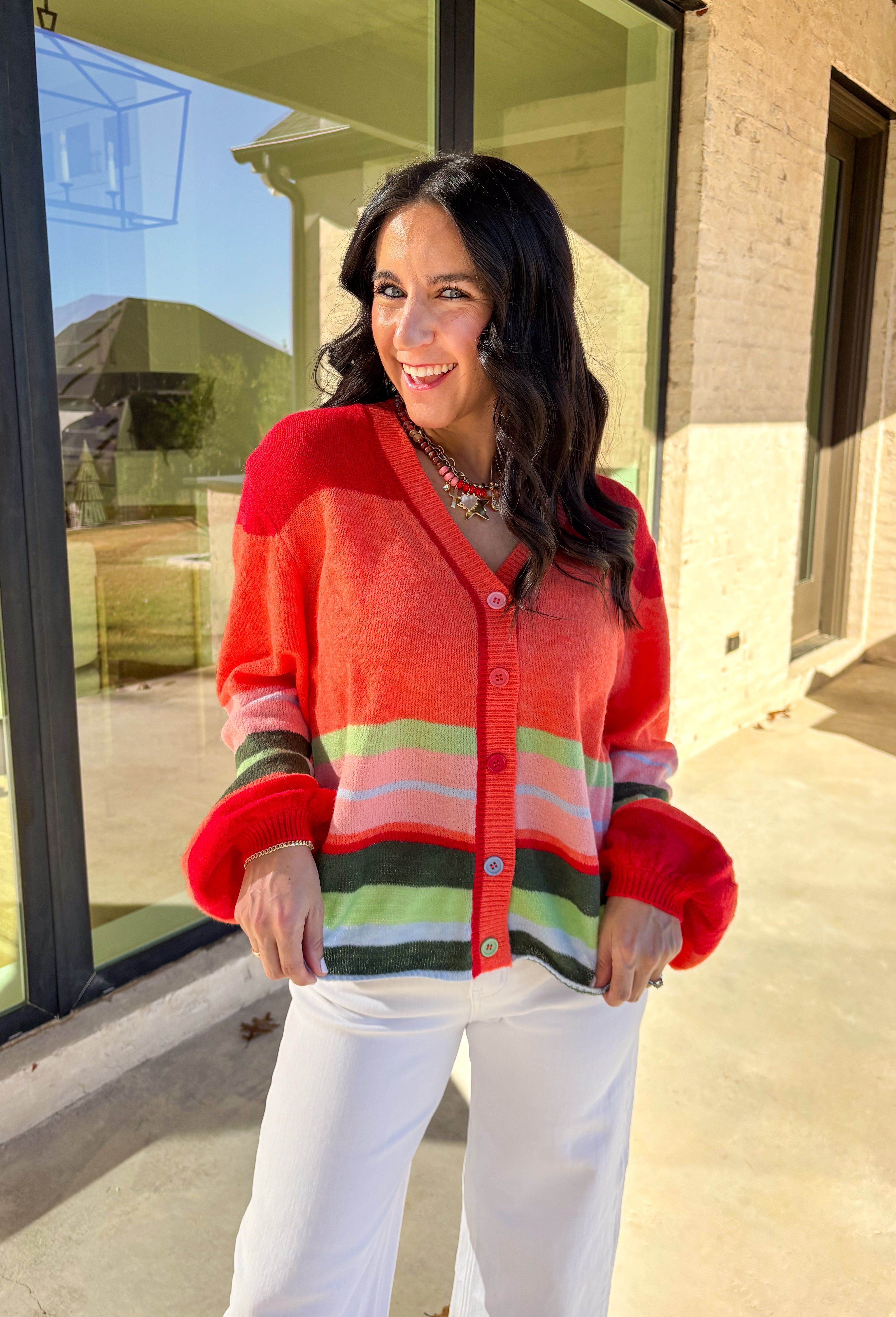 Bright, cozy, and perfect for spring layering, this coral button-down cardigan by Fate adds a happy pop of color to any outfit. Featuring a playful mix of red, pink, green, and blue stripes, this lightweight knit feels fun yet easy to wear. Soft and comfortable with just the right amount of warmth, it’s ideal for breezy mornings, cool evenings, or tossing on over your favorite spring basics.