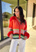 Bright, cozy, and perfect for spring layering, this coral button-down cardigan by Fate adds a happy pop of color to any outfit. Featuring a playful mix of red, pink, green, and blue stripes, this lightweight knit feels fun yet easy to wear. Soft and comfortable with just the right amount of warmth, it’s ideal for breezy mornings, cool evenings, or tossing on over your favorite spring basics.
