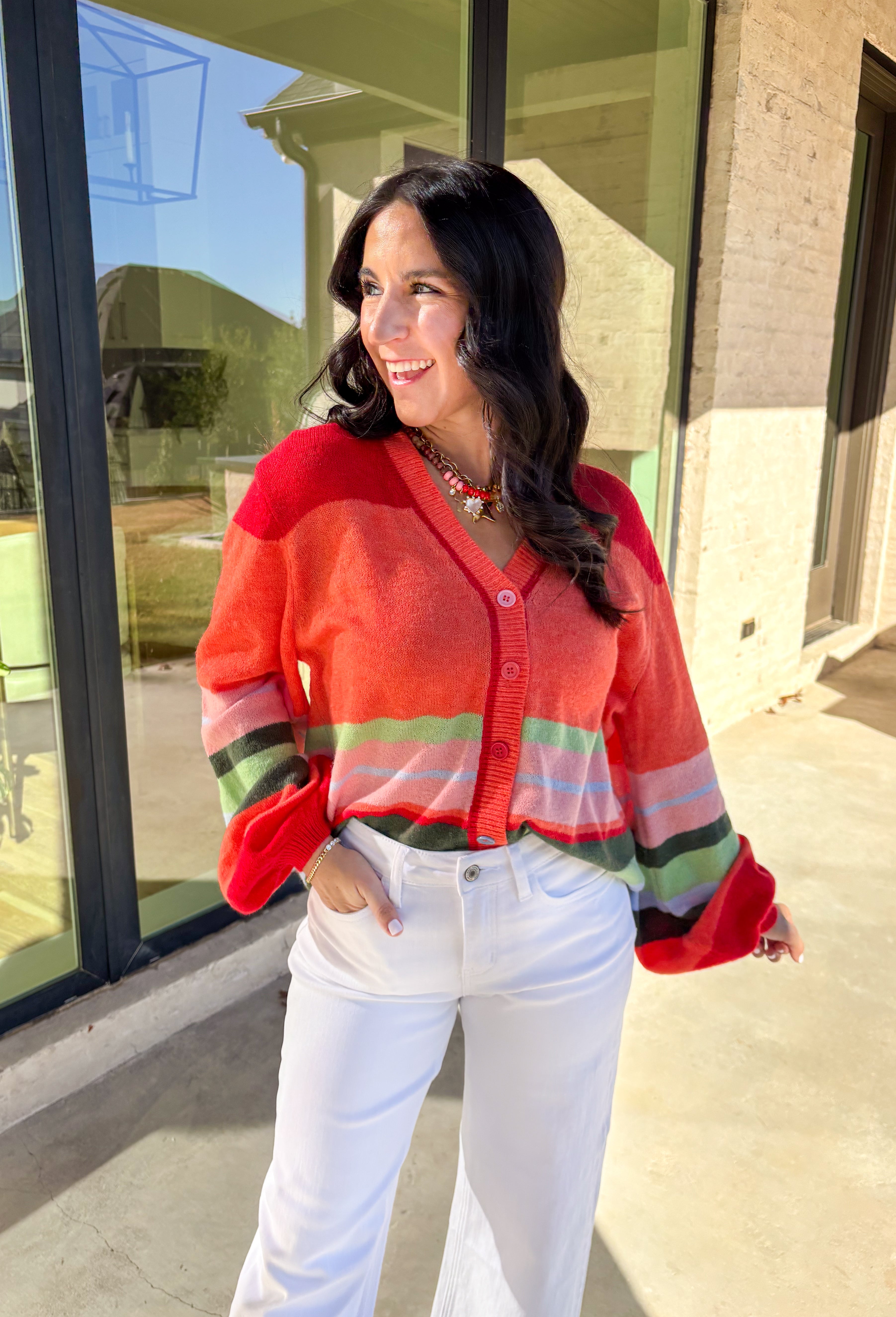 Bright, cozy, and perfect for spring layering, this coral button-down cardigan by Fate adds a happy pop of color to any outfit. Featuring a playful mix of red, pink, green, and blue stripes, this lightweight knit feels fun yet easy to wear. Soft and comfortable with just the right amount of warmth, it’s ideal for breezy mornings, cool evenings, or tossing on over your favorite spring basics.