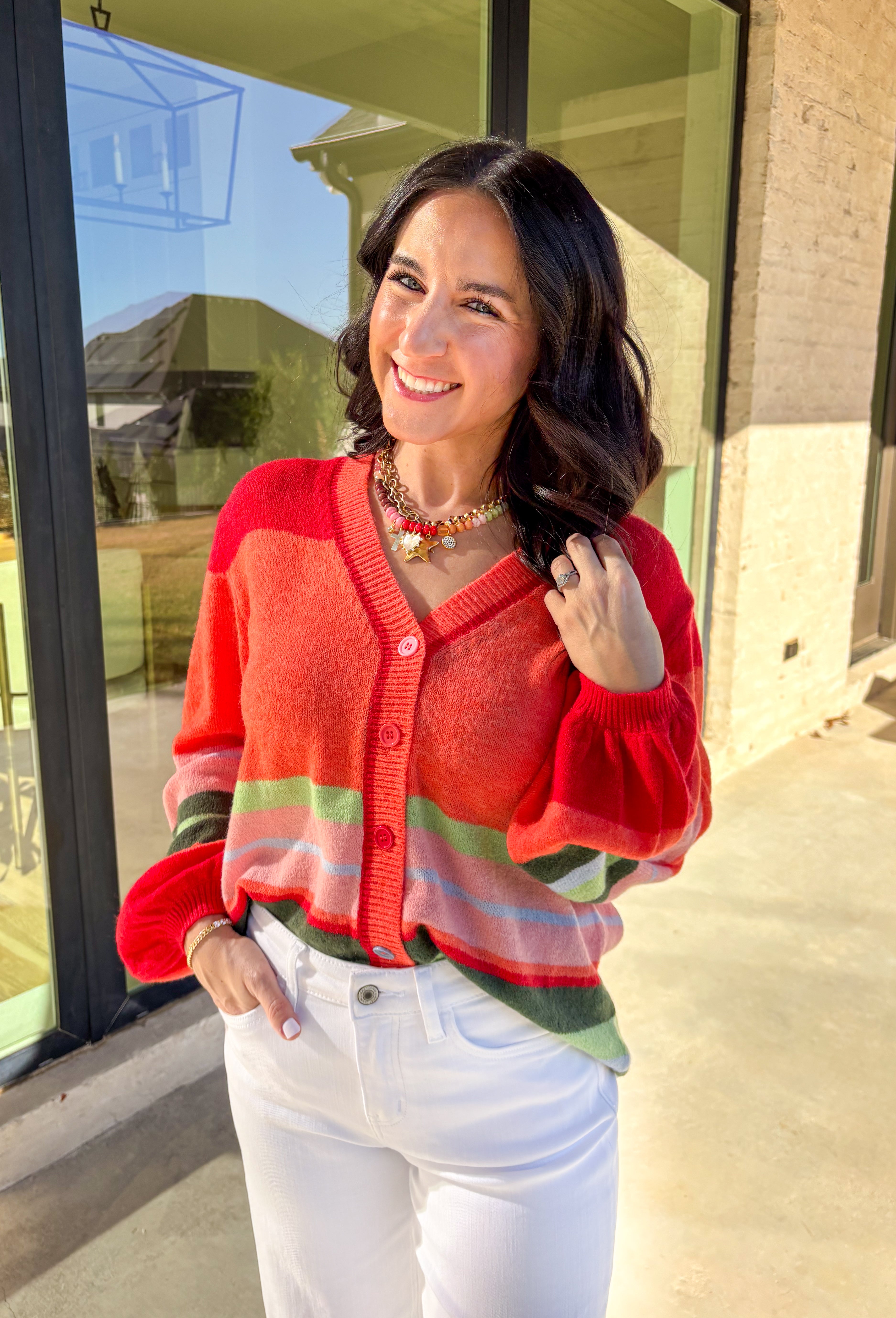 Bright, cozy, and perfect for spring layering, this coral button-down cardigan by Fate adds a happy pop of color to any outfit. Featuring a playful mix of red, pink, green, and blue stripes, this lightweight knit feels fun yet easy to wear. Soft and comfortable with just the right amount of warmth, it’s ideal for breezy mornings, cool evenings, or tossing on over your favorite spring basics.