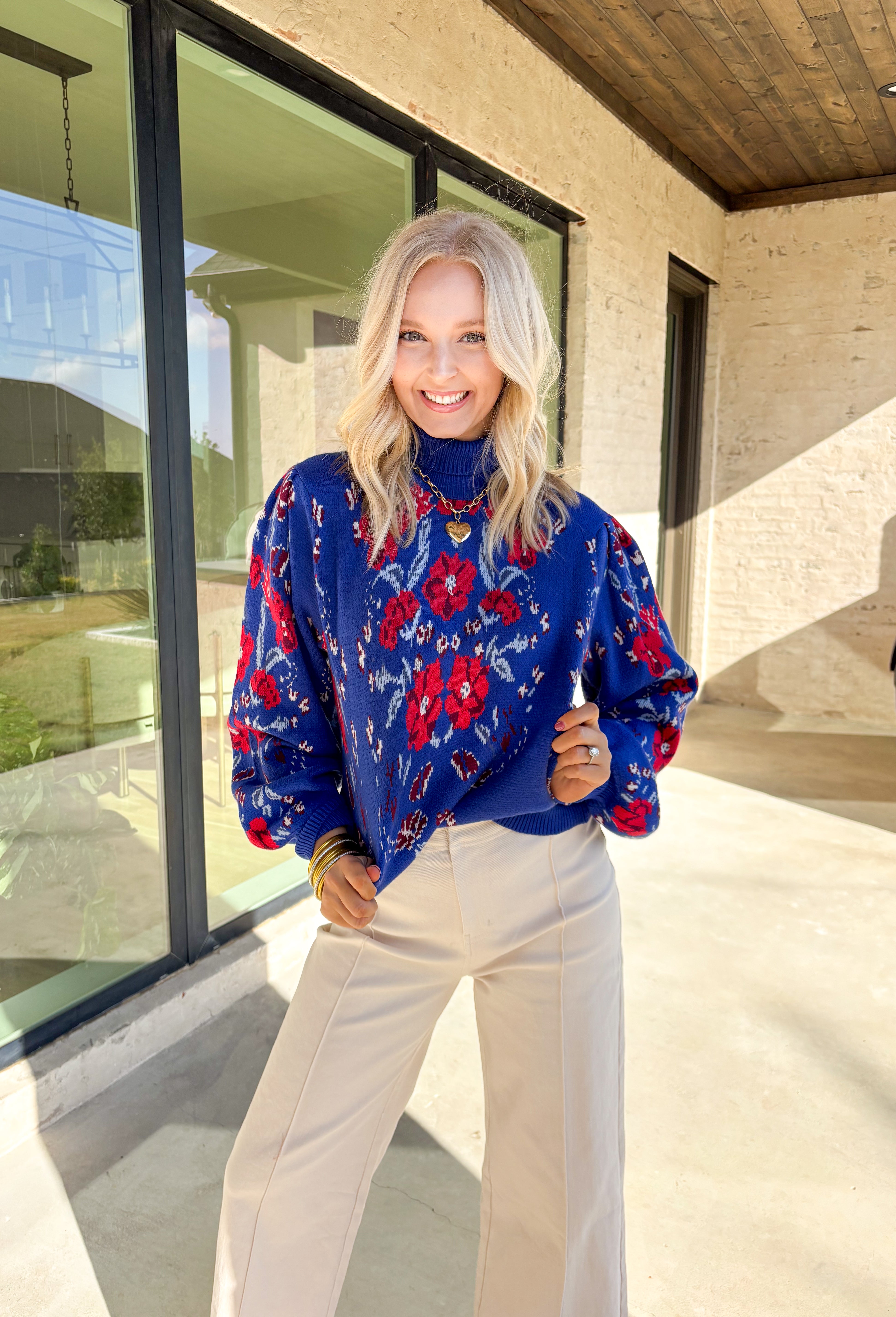 Brighten chilly days with this stunning royal blue turtleneck sweater by Voy. Adorned with a bold floral print in shades of red, blue, white, and burgundy, this cozy knit brings a cheerful pop of color to your winter wardrobe. The soft fabric blend offers both warmth and comfort, making it perfect for layering or wearing on its own for a statement cold-weather look.