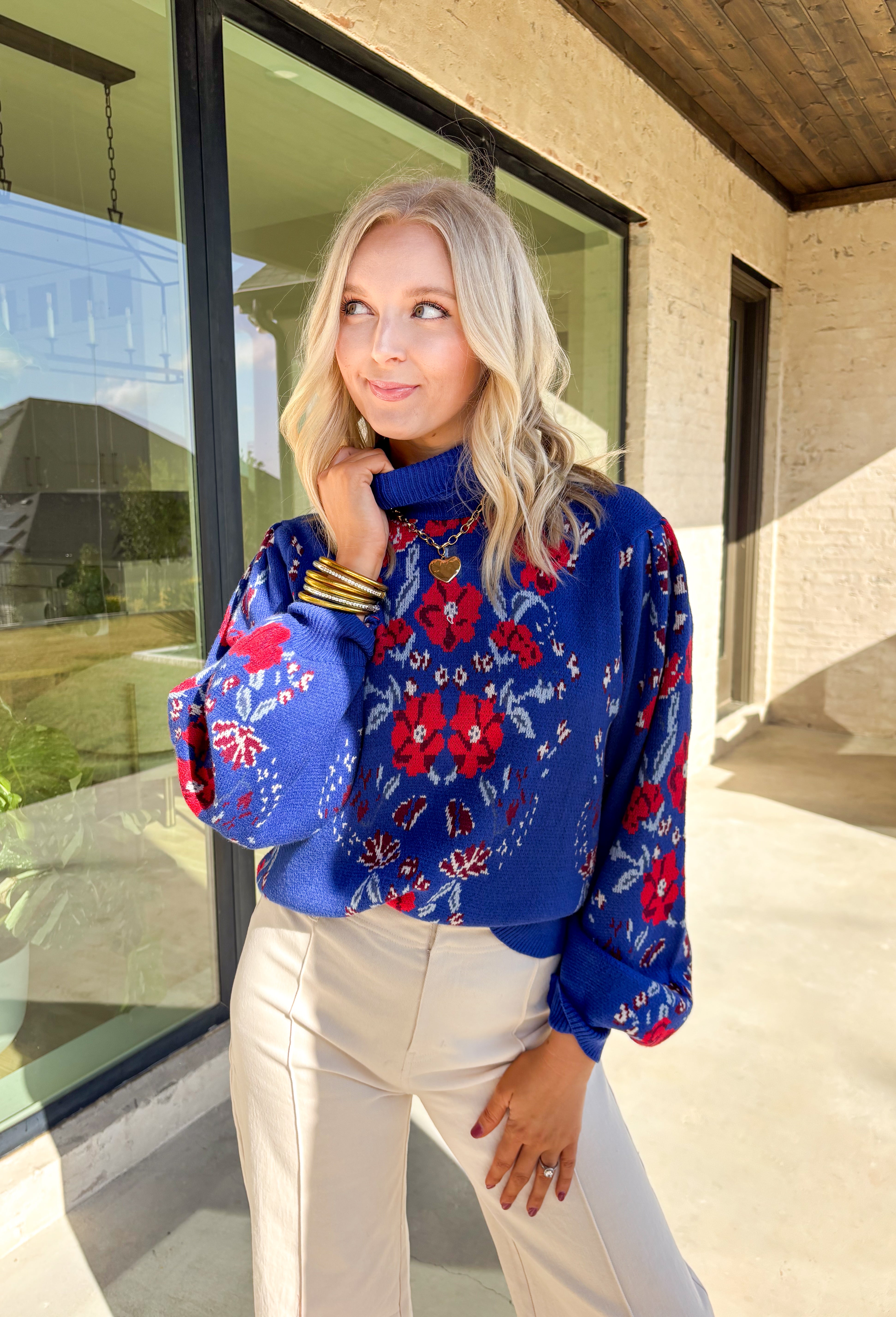 Brighten chilly days with this stunning royal blue turtleneck sweater by Voy. Adorned with a bold floral print in shades of red, blue, white, and burgundy, this cozy knit brings a cheerful pop of color to your winter wardrobe. The soft fabric blend offers both warmth and comfort, making it perfect for layering or wearing on its own for a statement cold-weather look.