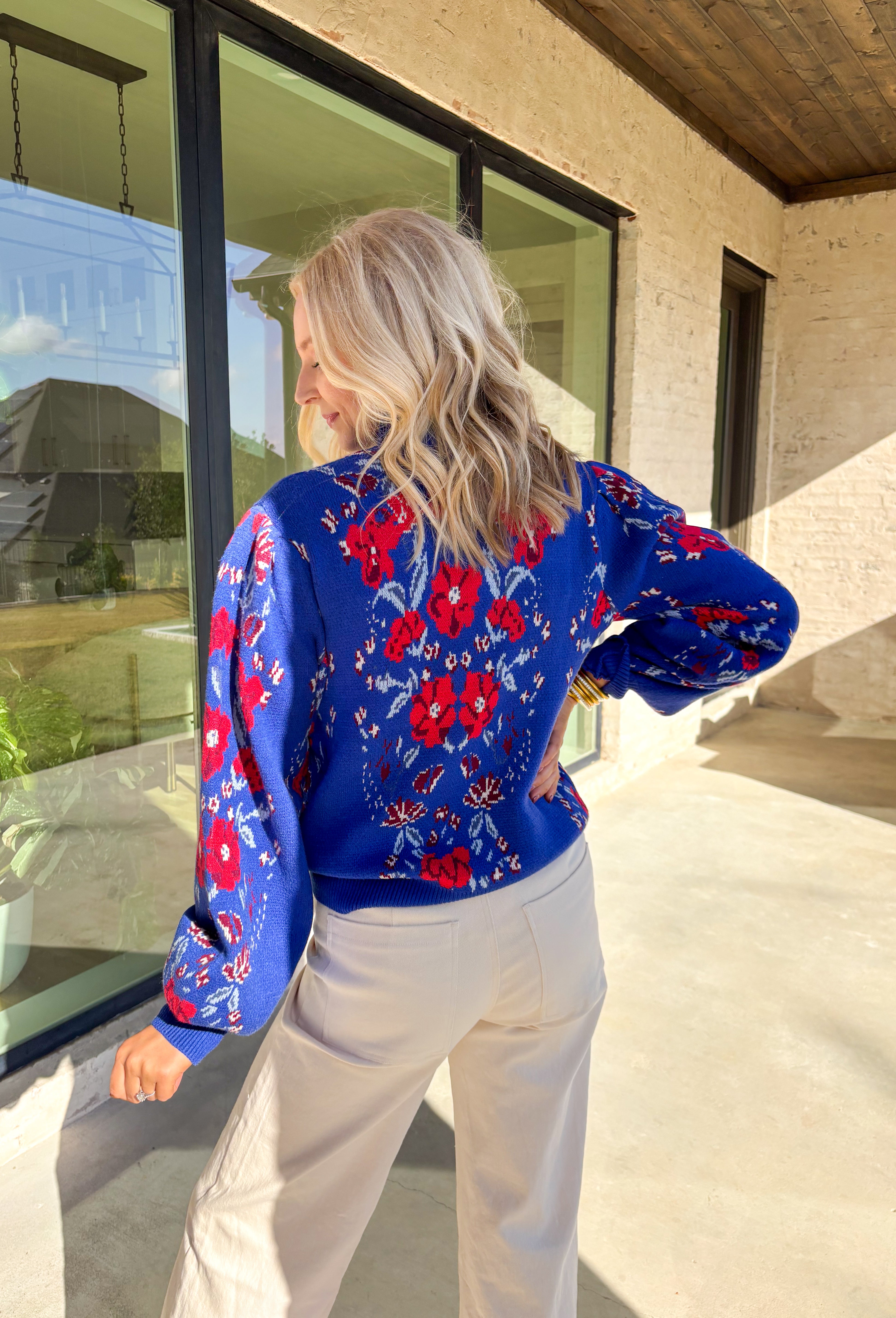 Brighten chilly days with this stunning royal blue turtleneck sweater by Voy. Adorned with a bold floral print in shades of red, blue, white, and burgundy, this cozy knit brings a cheerful pop of color to your winter wardrobe. The soft fabric blend offers both warmth and comfort, making it perfect for layering or wearing on its own for a statement cold-weather look.