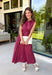 Bring effortless charm to your fall wardrobe with this beautifully detailed midi dress from Entro. Featuring rich plum and rust stripes, this timeless dress combines classic style with feminine touches you'll love. The collared neckline and button-front design create a polished silhouette, while the self-tie detail at the front adds a flattering, playful finish. 
