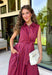 Bring effortless charm to your fall wardrobe with this beautifully detailed midi dress from Entro. Featuring rich plum and rust stripes, this timeless dress combines classic style with feminine touches you'll love. The collared neckline and button-front design create a polished silhouette, while the self-tie detail at the front adds a flattering, playful finish. 
