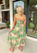 Elegant, feminine, and perfect for special moments! This green sleeveless midi dress features a bold neutral floral print that feels both eye-catching and timeless. The square neckline adds a flattering, structured touch while keeping the look soft and romantic. Designed with adjustable straps and a smocked back, this dress offers a comfortable fit that still shapes beautifully. The fully lined fabric drapes effortlessly, making it ideal for weddings, showers, dinner parties, or any occasion.