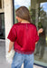 A rich red satin gives this short sleeve top from Sunday Edition the perfect festive feel for the holiday season. The smooth fabric adds a pretty touch of shine, while the lace hem brings in a soft detail that dresses up the simple silhouette. A keyhole opening at the back adds a finishing touch without taking away from the easy-to-style design. It’s a fun option for everything from Christmas parties and holiday dinners to festive date nights and seasonal get-togethers. 