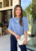 Wrap yourself in effortless comfort with this cozy sweater from The Workshop. Designed in a soft dusty blue hue, this timeless knit is the perfect everyday piece for the fall season. The simple silhouette makes it easy to style with everything from your favorite denim to tailored trousers, while the ribbed neckline, cuffs, and hem add a classic finishing touch. Crafted from a soft recycled knit blend, this lightweight sweater offers just the right amount of warmth for crisp mornings and cool evenings.