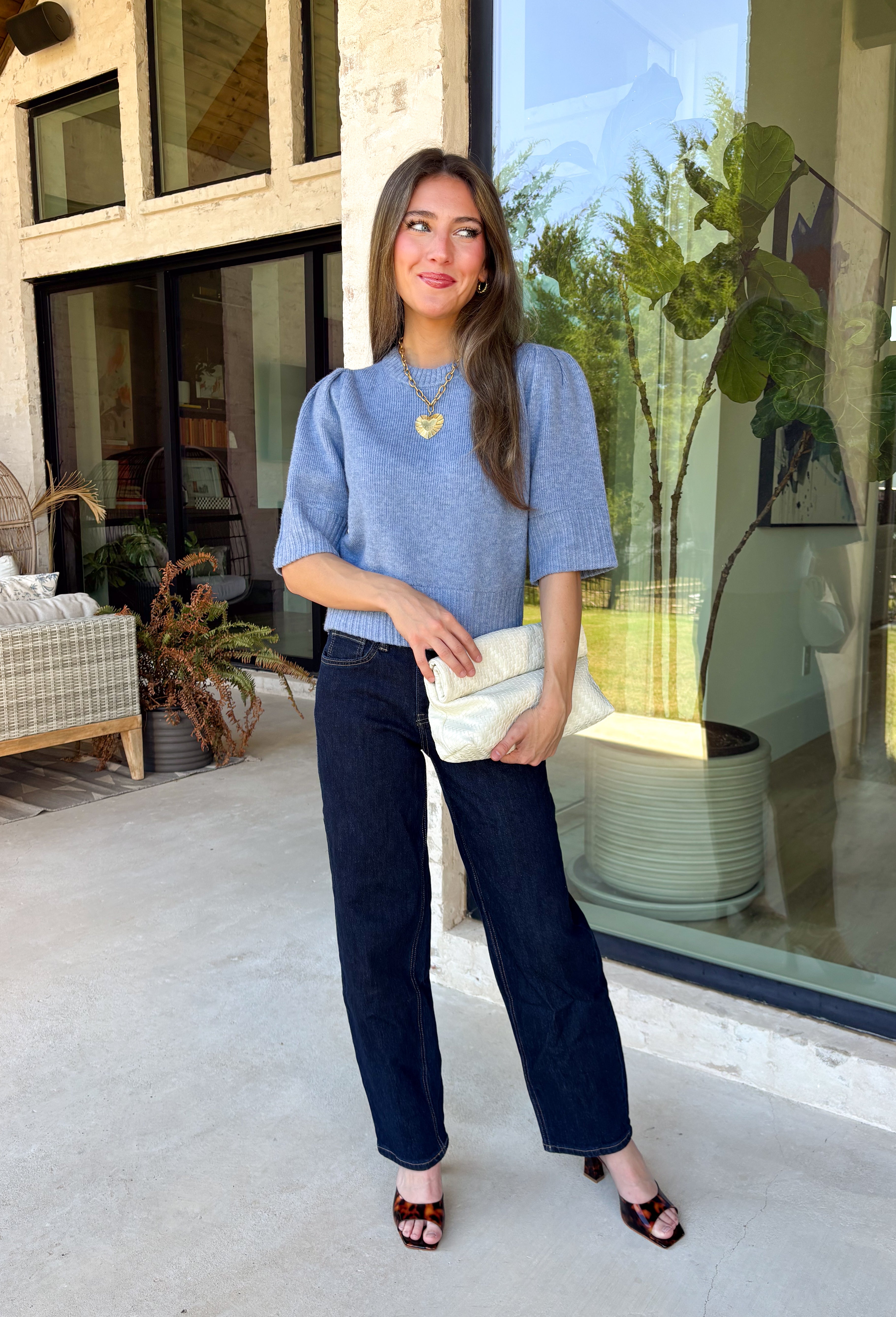 Wrap yourself in effortless comfort with this cozy sweater from The Workshop. Designed in a soft dusty blue hue, this timeless knit is the perfect everyday piece for the fall season. The simple silhouette makes it easy to style with everything from your favorite denim to tailored trousers, while the ribbed neckline, cuffs, and hem add a classic finishing touch. Crafted from a soft recycled knit blend, this lightweight sweater offers just the right amount of warmth for crisp mornings and cool evenings.