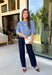 Wrap yourself in effortless comfort with this cozy sweater from The Workshop. Designed in a soft dusty blue hue, this timeless knit is the perfect everyday piece for the fall season. The simple silhouette makes it easy to style with everything from your favorite denim to tailored trousers, while the ribbed neckline, cuffs, and hem add a classic finishing touch. Crafted from a soft recycled knit blend, this lightweight sweater offers just the right amount of warmth for crisp mornings and cool evenings.