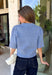 Wrap yourself in effortless comfort with this cozy sweater from The Workshop. Designed in a soft dusty blue hue, this timeless knit is the perfect everyday piece for the fall season. The simple silhouette makes it easy to style with everything from your favorite denim to tailored trousers, while the ribbed neckline, cuffs, and hem add a classic finishing touch. Crafted from a soft recycled knit blend, this lightweight sweater offers just the right amount of warmth for crisp mornings and cool evenings.