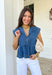 This sleeveless medium wash denim top by Entro is the kind of spring staple you’ll keep reaching for again and again! With its classic collared neckline and easy cropped length, it gives you that effortlessly cool, “threw this on and still look cute” vibe in seconds. The medium wash keeps it timeless and easy to style, whether you’re pairing it with white jeans, shorts, or even a flowy skirt for a fun mix of casual and feminine.