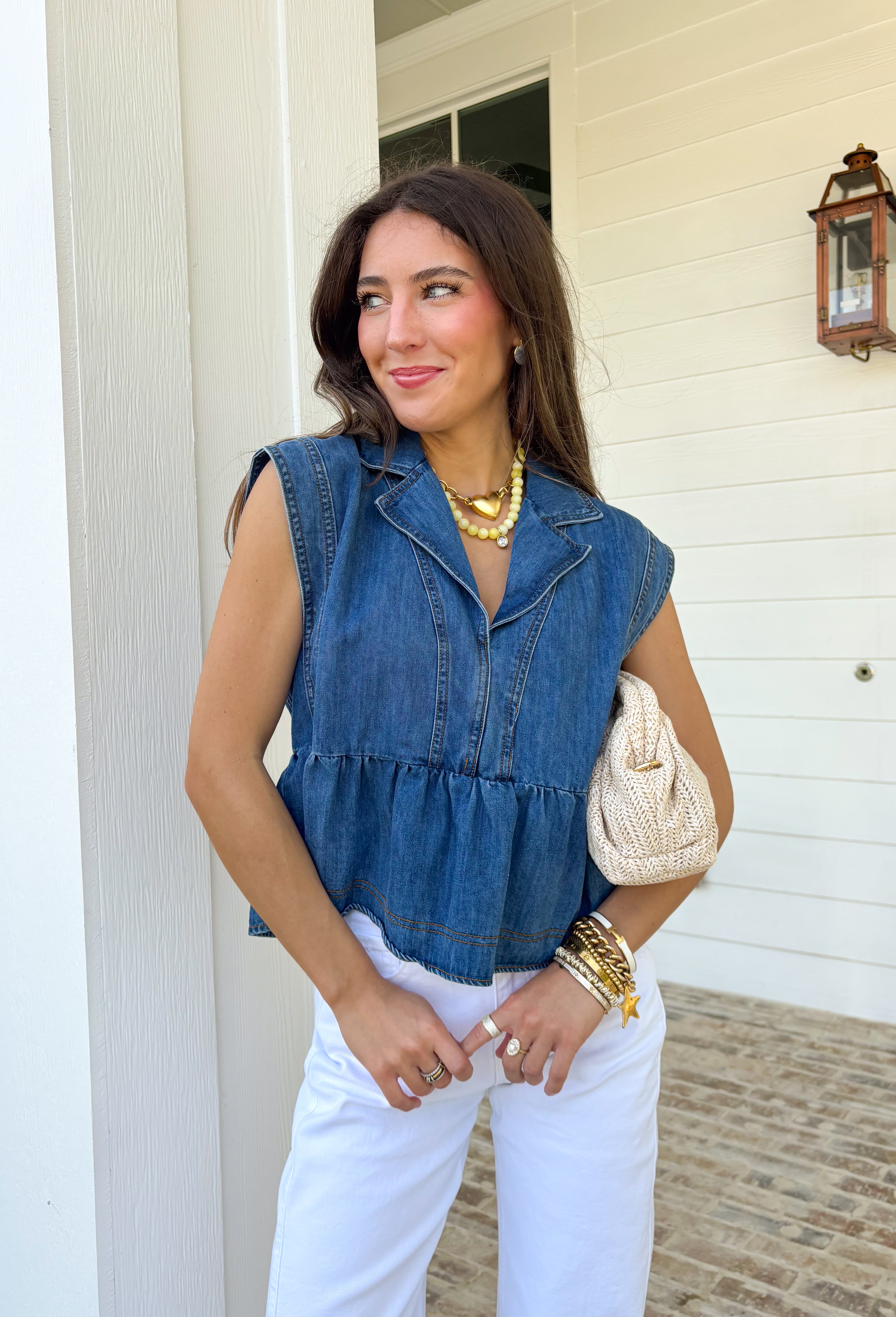 This sleeveless medium wash denim top by Entro is the kind of spring staple you’ll keep reaching for again and again! With its classic collared neckline and easy cropped length, it gives you that effortlessly cool, “threw this on and still look cute” vibe in seconds. The medium wash keeps it timeless and easy to style, whether you’re pairing it with white jeans, shorts, or even a flowy skirt for a fun mix of casual and feminine.