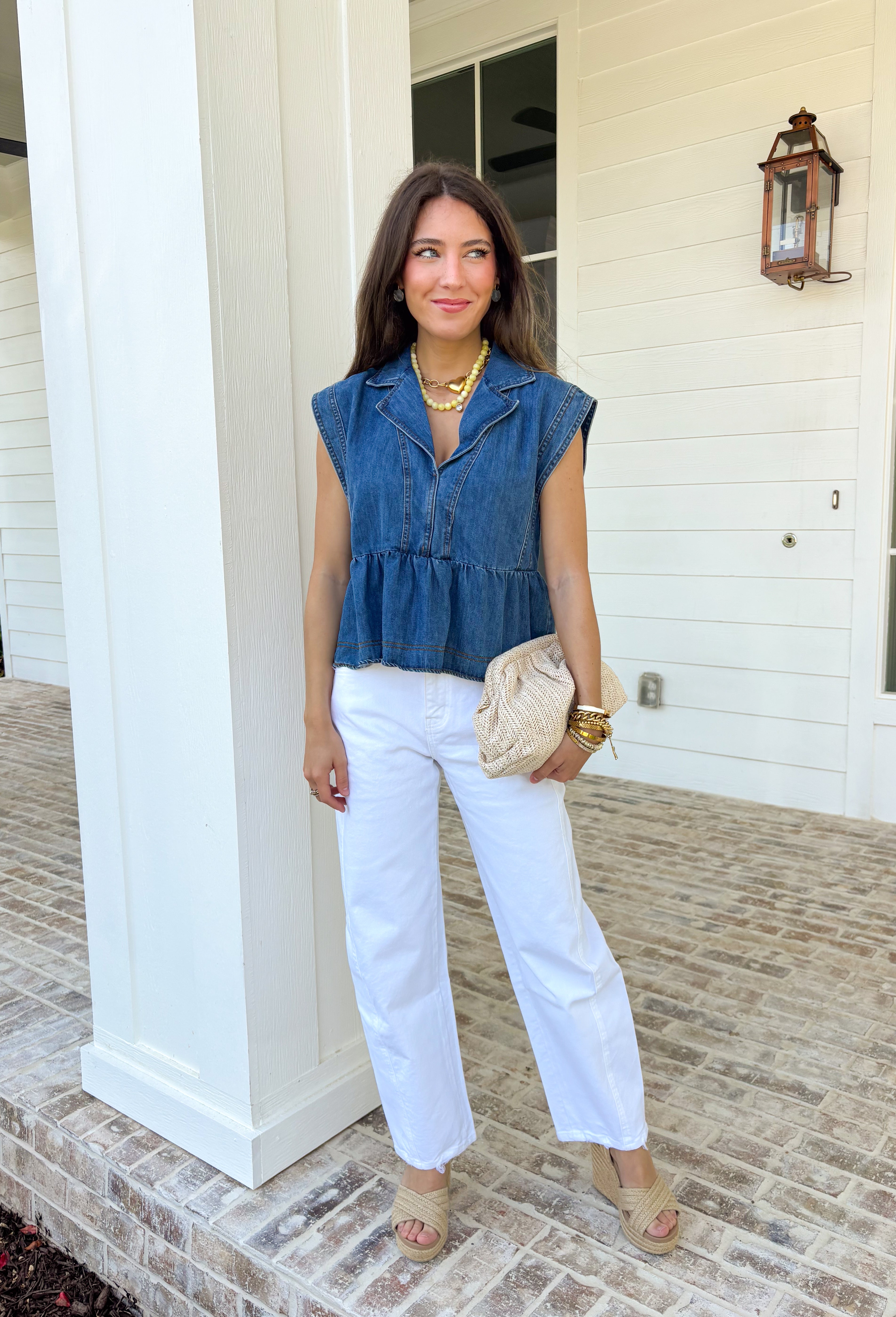 This sleeveless medium wash denim top by Entro is the kind of spring staple you’ll keep reaching for again and again! With its classic collared neckline and easy cropped length, it gives you that effortlessly cool, “threw this on and still look cute” vibe in seconds. The medium wash keeps it timeless and easy to style, whether you’re pairing it with white jeans, shorts, or even a flowy skirt for a fun mix of casual and feminine.
