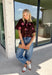 Bring a touch of effortless charm to your everyday wardrobe with this beautiful floral blouse from THML. Designed with a rich brown backdrop and a pink floral print, this timeless top is full of feminine details you'll love. The button-front design offers classic style, while the subtle ruffle neckline adds a delicate finishing touch. Crafted from breathable cotton, this versatile blouse transitions beautifully from the office to weekend outings, making it an easy favorite for the fall season.