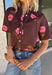 Bring a touch of effortless charm to your everyday wardrobe with this beautiful floral blouse from THML. Designed with a rich brown backdrop and a pink floral print, this timeless top is full of feminine details you'll love. The button-front design offers classic style, while the subtle ruffle neckline adds a delicate finishing touch. Crafted from breathable cotton, this versatile blouse transitions beautifully from the office to weekend outings, making it an easy favorite for the fall season.