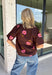Bring a touch of effortless charm to your everyday wardrobe with this beautiful floral blouse from THML. Designed with a rich brown backdrop and a pink floral print, this timeless top is full of feminine details you'll love. The button-front design offers classic style, while the subtle ruffle neckline adds a delicate finishing touch. Crafted from breathable cotton, this versatile blouse transitions beautifully from the office to weekend outings, making it an easy favorite for the fall season.