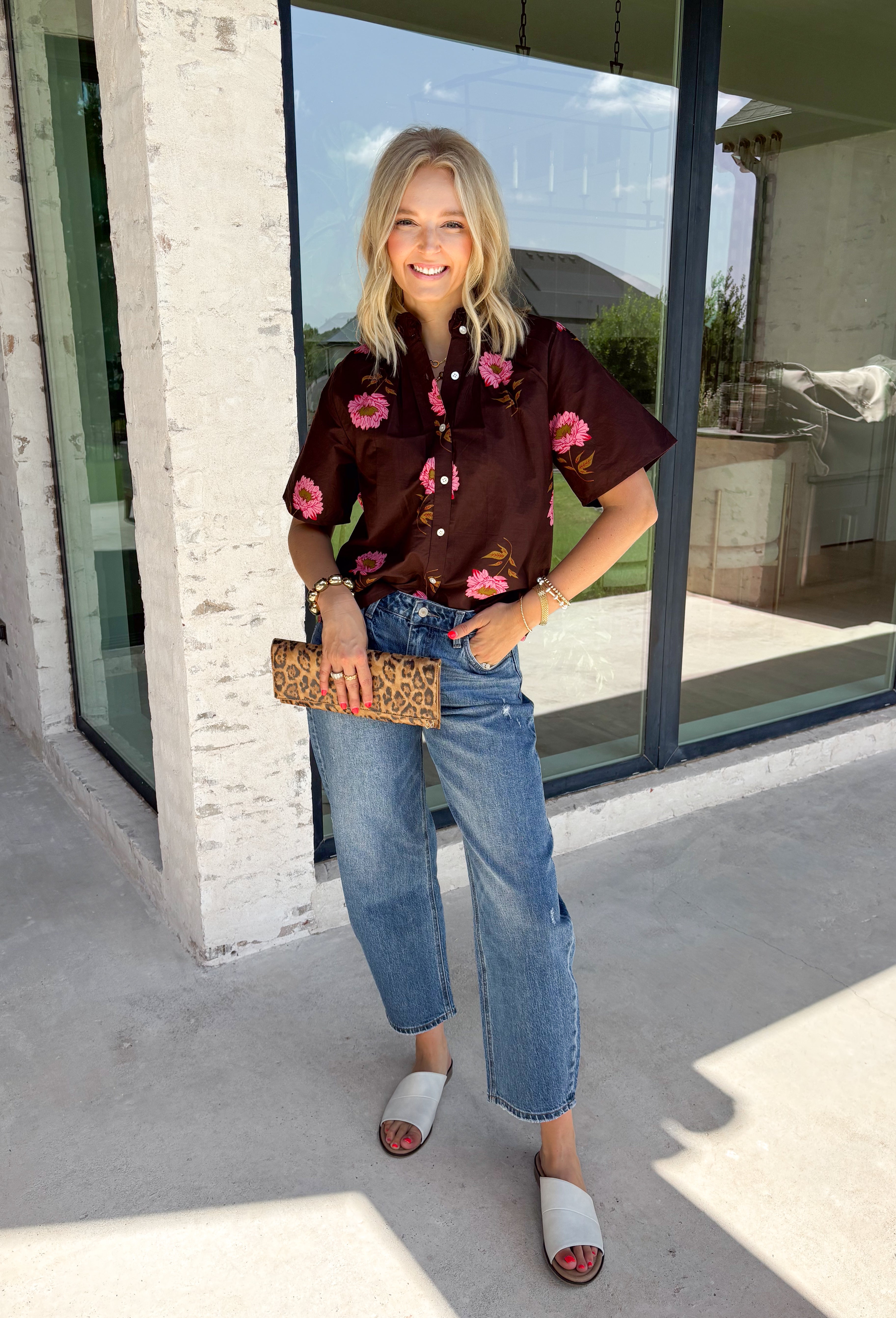 Bring a touch of effortless charm to your everyday wardrobe with this beautiful floral blouse from THML. Designed with a rich brown backdrop and a pink floral print, this timeless top is full of feminine details you'll love. The button-front design offers classic style, while the subtle ruffle neckline adds a delicate finishing touch. Crafted from breathable cotton, this versatile blouse transitions beautifully from the office to weekend outings, making it an easy favorite for the fall season.