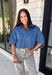 A classic denim top is a staple you'll reach for season after season! Crafted from soft medium wash denim, this effortless button-down blouse is designed with relaxed dolman sleeves and a subtle high-low hem for an easy, flattering fit. The collared neckline adds a timeless touch, making it simple to dress up or keep casual. Whether you're layering it under a blazer or wearing it on its own with your favorite fall denim, this versatile piece belongs in every autumn wardrobe.