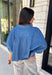 A classic denim top is a staple you'll reach for season after season! Crafted from soft medium wash denim, this effortless button-down blouse is designed with relaxed dolman sleeves and a subtle high-low hem for an easy, flattering fit. The collared neckline adds a timeless touch, making it simple to dress up or keep casual. Whether you're layering it under a blazer or wearing it on its own with your favorite fall denim, this versatile piece belongs in every autumn wardrobe.