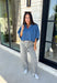 A classic denim top is a staple you'll reach for season after season! Crafted from soft medium wash denim, this effortless button-down blouse is designed with relaxed dolman sleeves and a subtle high-low hem for an easy, flattering fit. The collared neckline adds a timeless touch, making it simple to dress up or keep casual. Whether you're layering it under a blazer or wearing it on its own with your favorite fall denim, this versatile piece belongs in every autumn wardrobe.