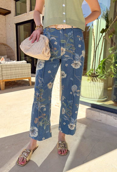 Fresh, fun, and effortlessly wearable, these medium wash wide leg jeans by Entro are a perfect way to bring florals into your spring denim lineup. Featuring a muted floral print throughout, they add subtle interest while still feeling easy to style. The exposed seam down the front gives a flattering, elongating look, and the wide leg silhouette keeps them relaxed and on-trend. These are the kind of jeans that make even a simple tee feel styled.